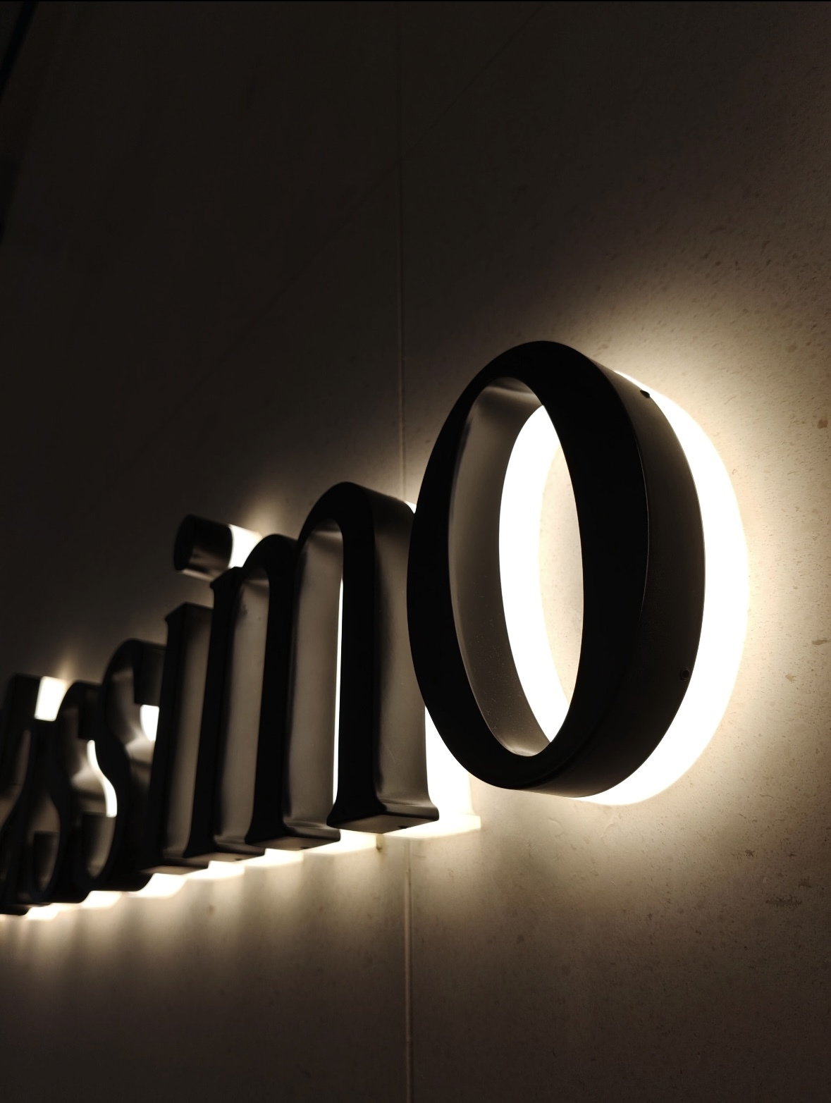 Custom halo‑lit 3D metal letters, office branding wall sign