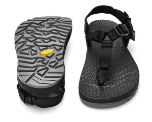 A side by side view of the top and bottom of the sandals showing the aggressive Vibram sole with Megagrip and simple webbed upper with a more cushioned footbed. A side by side view of the top and bottom of the sandals showing the aggressive Vibram sole with Megagrip and simple webbed upper with a more cushioned footbed.