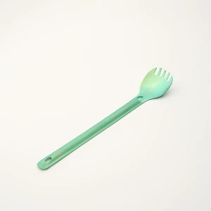 shows long handled spork with polished bowl and a green color
