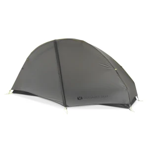 Grey, sleek, half-dome shaped tent viewed from the side. Seen in photo is large vestibule protruding from the tent.