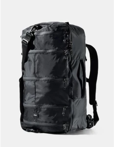 shows duffel bag with many zipper compartments on the front, backpack straps and a detachable duffle strap.