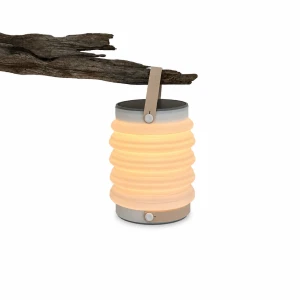 Shows expanded lantern  with handle, solar panels on top, flashlight on the bottom and a warm toned light
