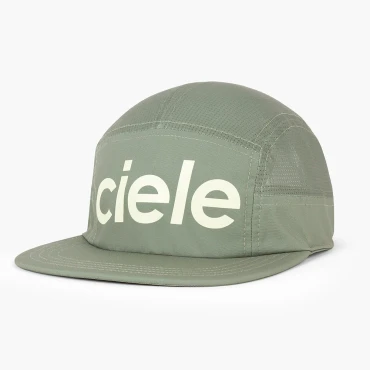 Shows 5 panel, flat-brimmed hat with mesh top, back, and side panels with a printed logo on the front