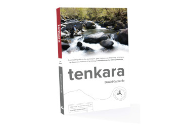Tenkara book from the front. Has image of a stream on top.