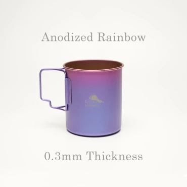 shows small titanium cup with fold-away handle and gradient blue, purple, and pink color