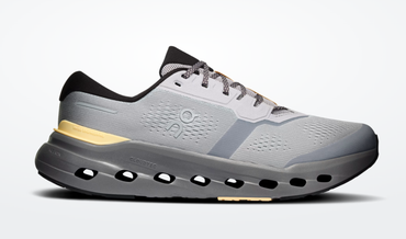 A right shoe profile showing the Cloud-Tec cells in the midsole for cushion and responsiveness. It has a dark grey sole and light greyish silver mesh upper.
