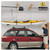 Shows a person using the fully set up hoister to lift a kayak off his car.