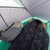 Image of the inside of the tent. The 1.5 adds extra internal space compared to a typical 1 person tent. Can see a backpack + sleeping bag within tent.