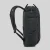 Side-on view of the backpack showing the top zip, side strap, and mesh water bottle pouch.