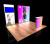 10'x10' backlit lightbox trade show display with monitor mount and backlit counter