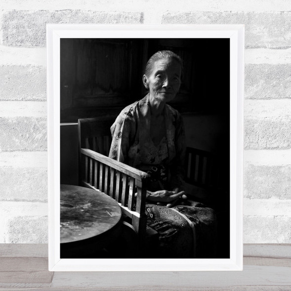 Old Woman On Wooden Chair By Table Black And White Wall Art Print