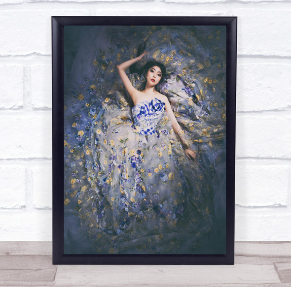 Asian woman blue floral dress laying down Wall Art Print