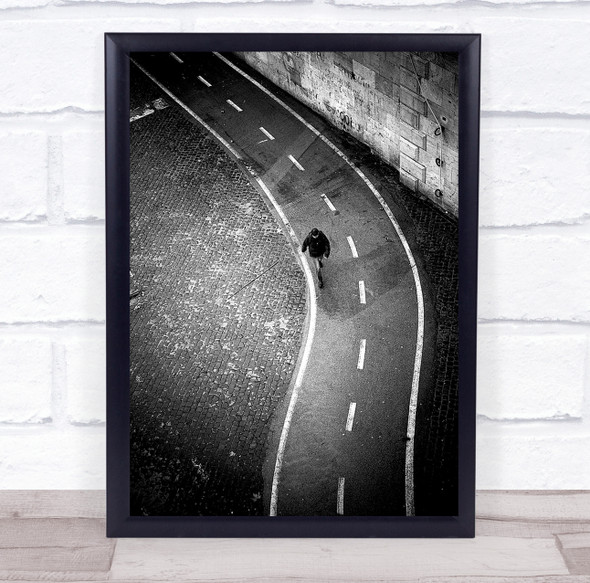 Person walking in road aerial brick wall Wall Art Print