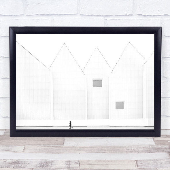 Small figure walking by empty houses Wall Art Print