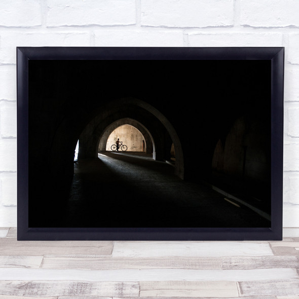 Light tunnel man on bike Wall Art Print