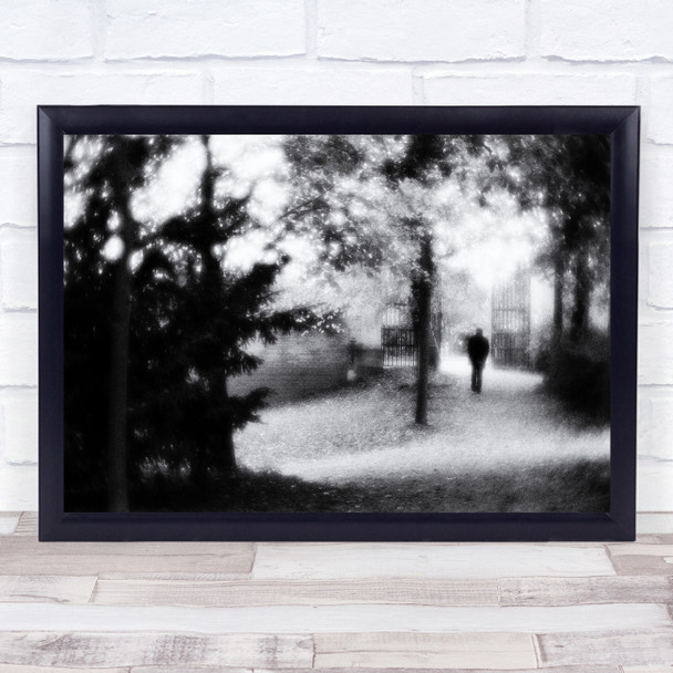 Walking Black & White man strolling trees gate path Wall Art Print