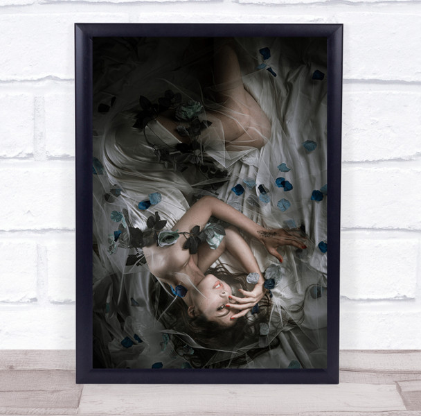 Woman in white dress laying blue flower Wall Art Print