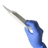 Flat Compressed Gauze, in hand showing thinness