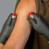 NAR BOA® IV-Constricting Band, being put around arm