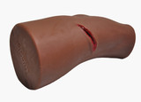 Dark Tone PCT3 Leg Trainer by TrueClot with gauze stuffed in knife wound