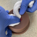 Dark Tone Luna TrueClot Basic Packing Trainer (BPT) wound simulator trainer showing artificial gun shot wound, In use
