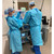 Disposable Fluid Resistant Gown shown in hospital lab setting