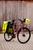 Yellow PAX bicycle bag on side of bike, front angle