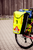 Yellow PAX bicycle bag on side of bike, side angle