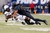 Memphis Tigers defensive back Chris Claybrooks wraps up Cincinnati's Thomas Geddis. Courtesy Max Gersh / The Commercial Appeal