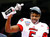 Louisville quarterback Teddy Bridgewater holds up his MVP trophy after the Cardinals beat the Florida Gators in the Sugar Bowl. PHOTO BY RUSTY COSTANZA
