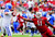University of Louisville's B.J. Dubose (11) fought off University of Kentucky's Kevin Mitchell (79) to put pressure on quarterback Maxwell Smith. PHOTO BY DAVID LEE HARTLAGE