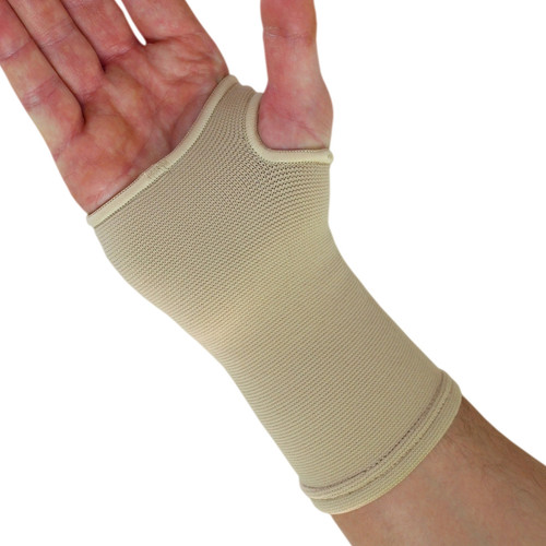A person's hand with a NeoPhysio Medical Grade Elastic Compression Wrist Support.