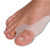 A person's toe with a NeoPhysio Gel Bunion Corrector protecting it. A person's toe with a NeoPhysio Gel Bunion Corrector protecting it.