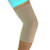 A woman wearing a medical grade NeoPhysio Elastic Compression Elbow Support.