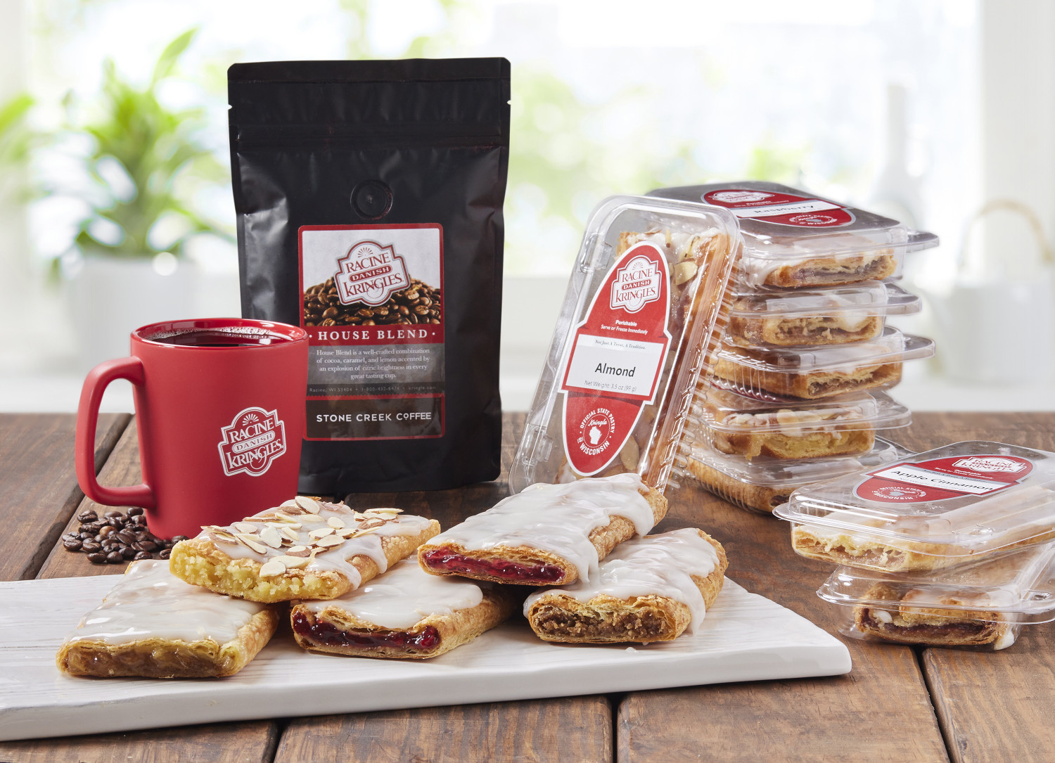 A Baker's Dozen Kringle with Stone Creek Coffee and a red Racine Danish Kringle mug.