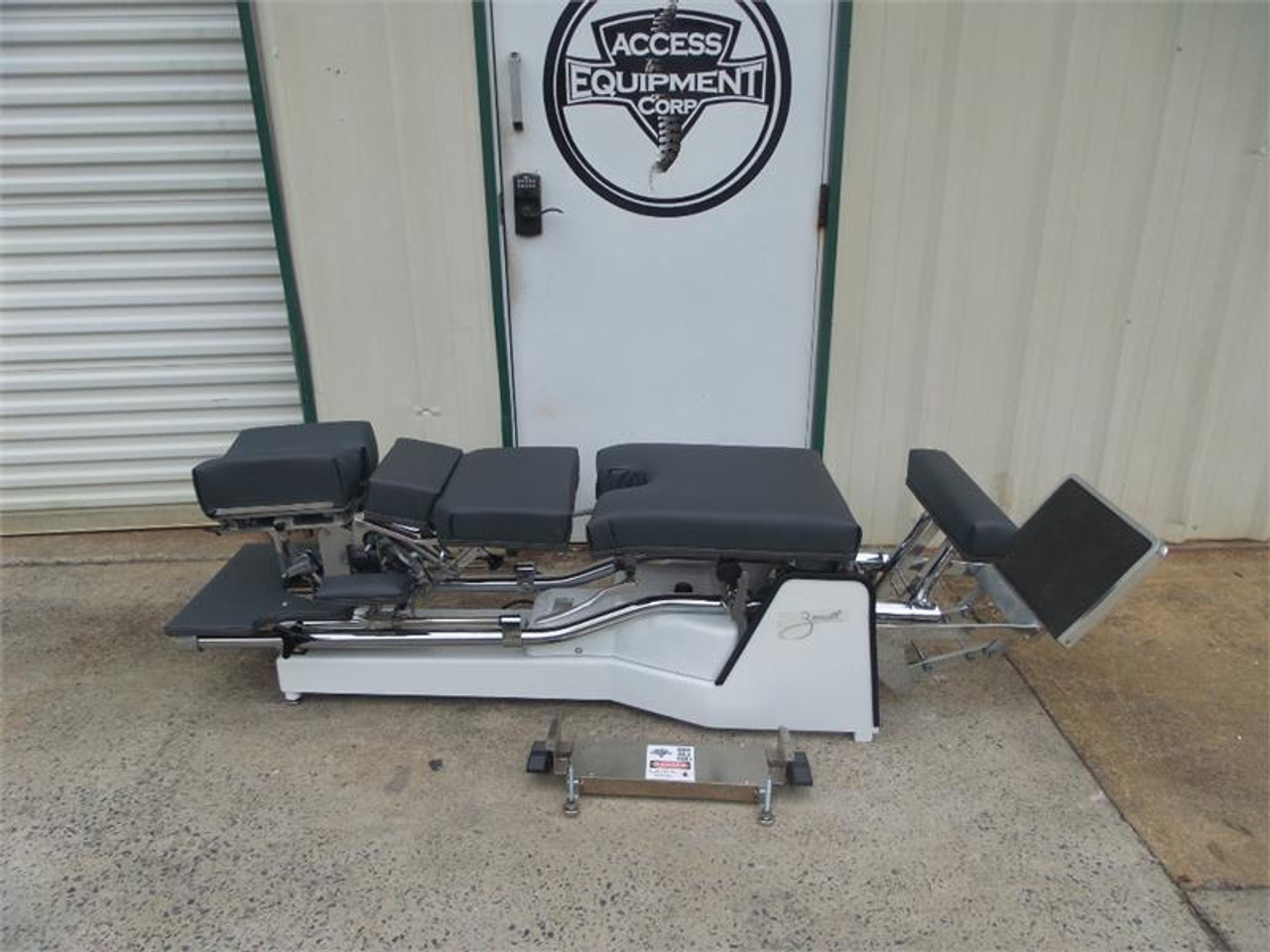 Used Zenith II 220F Hylo Table shown with Negative and Positive Tilt head ,Forward Motion Cervical Drop.