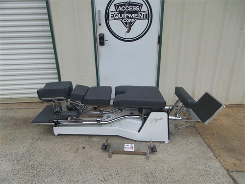 Used Zenith II 220F Hylo Table shown with Negative and Positive Tilt head ,Forward Motion Cervical Drop.