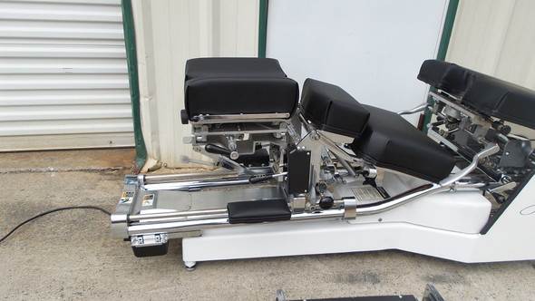 This Used Zenith II 220S Hylo Table is shown with Cervical Elevated and Breakaway chest open and locked in down position.