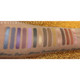 warm, colorful eyeshadow swatches of the Hot Mess Palette Deep on a medium dark skin tone.
