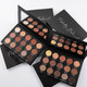 Two open eye shadow palettes with neutral warm shadows
