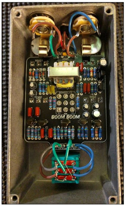 The BoomBoom is a 95% Brassmaster. It uses a more widely available transformer than the vintage unit (but similar spec) and it adds an output volume control.