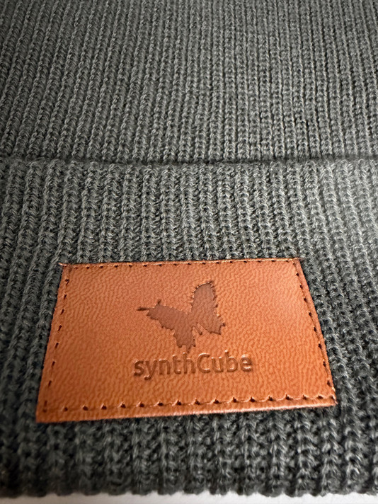 Closeup image of faux leather patch with logo