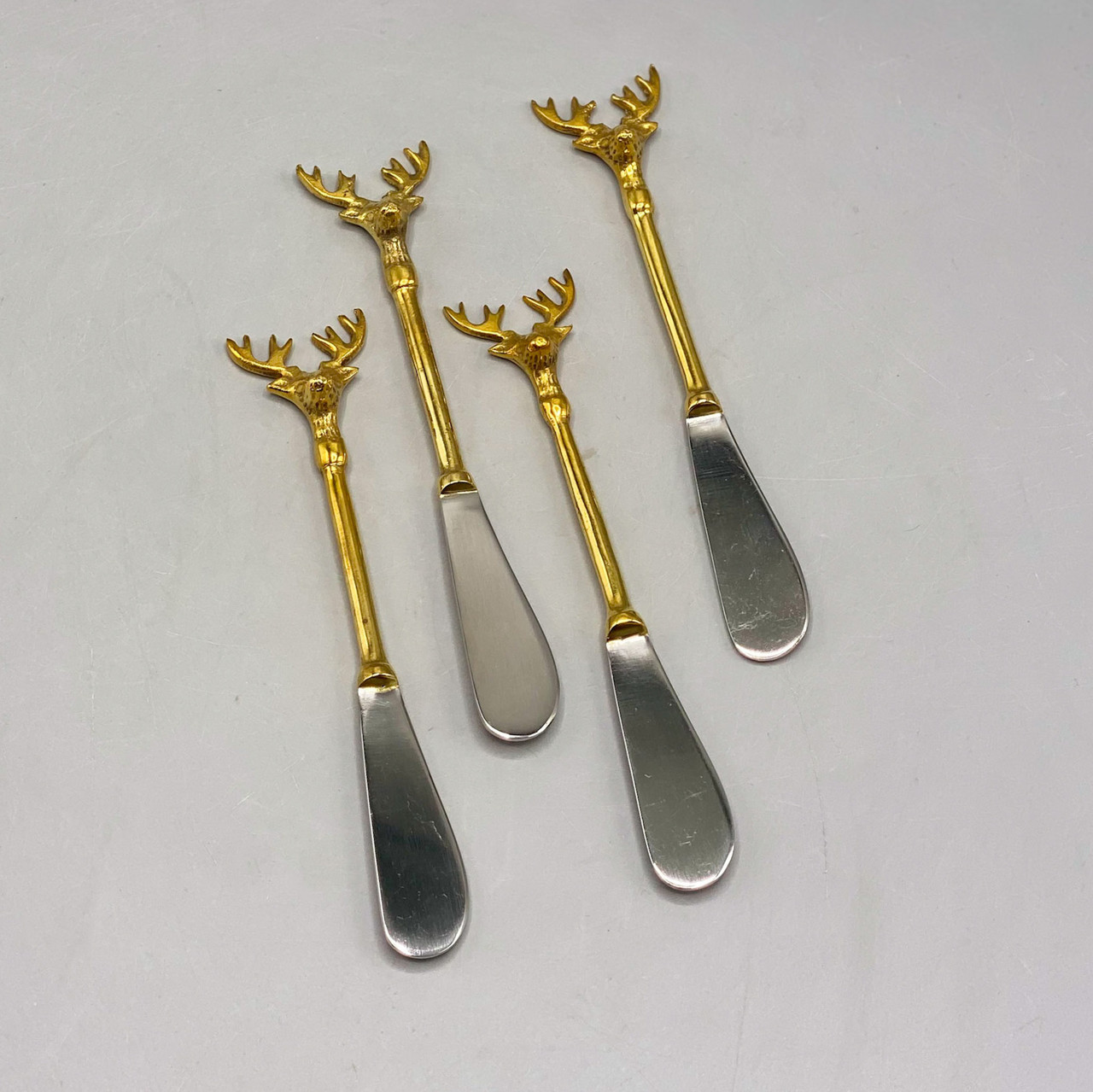 Creative Co-op Brass Cheese Knives with Reindeer Handles, Set of 3 in Printed Drawstring Bag