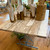 This Iron & Antique Wood Table is a one-of-a-kind piece of Ocean Springs History. The planks of wood are from the Newcomb Clark house that was built in 1904 in Ocean Springs, on Porter Ave.