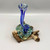 Blue Twisted Molten Glass Vase on Driftwood