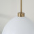 Capital 1-Light Pendant in Aged Brass and White 