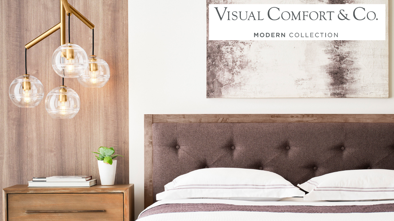 Sedona Single Chandelier in aged brass finish styled in a bedroom over a nightstand.