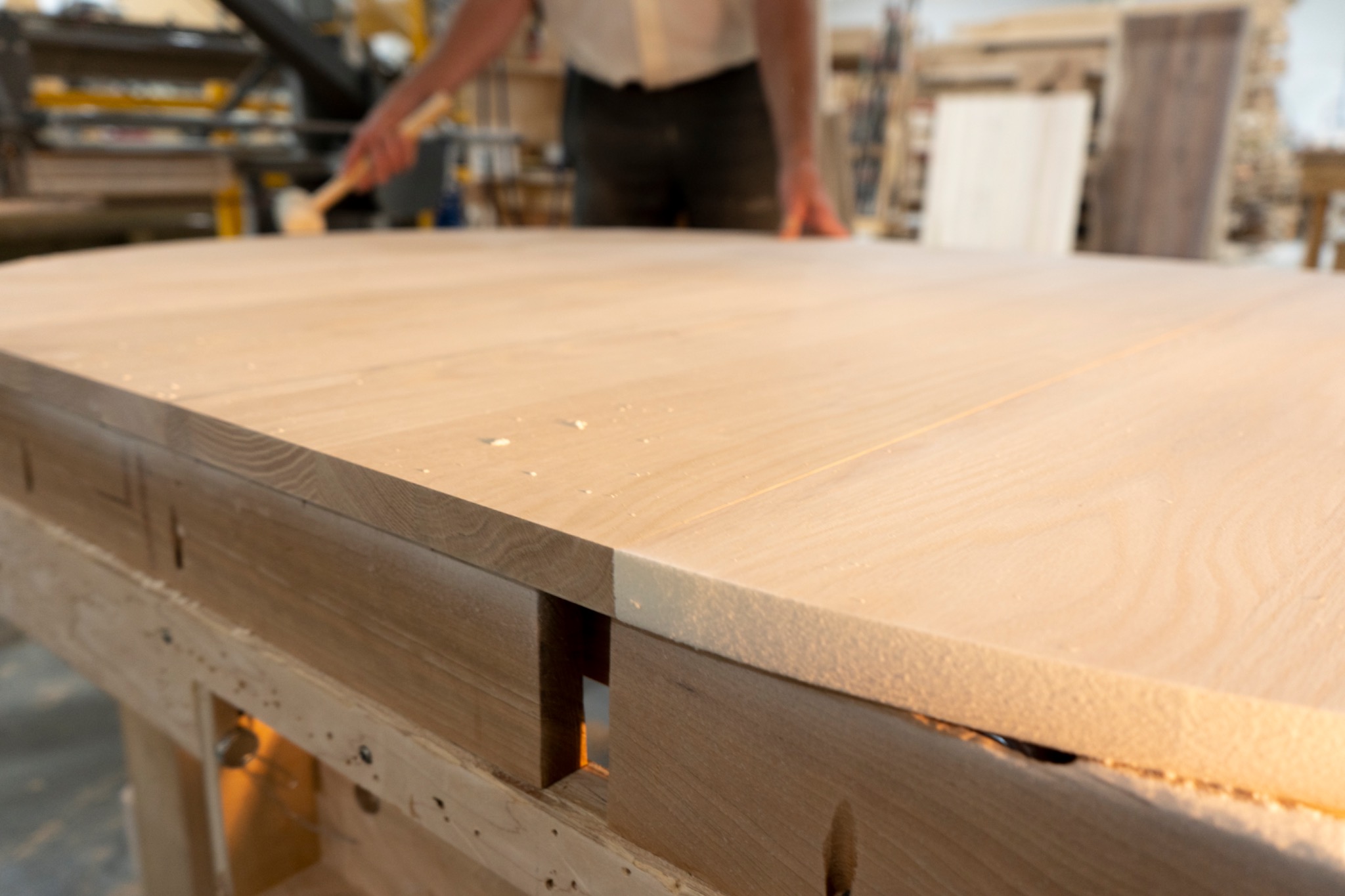 Natural grain and color variation across a broad wooden tabletop