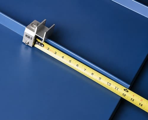 Measuring RoofClamp placement on a standing seam metal roof for RCB-3 SnoBar installation