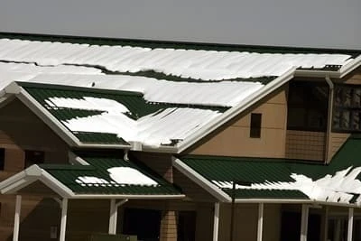 Multiple rows of SnoBar, ColorBar or WindBar snow rails on standing seam metal roof